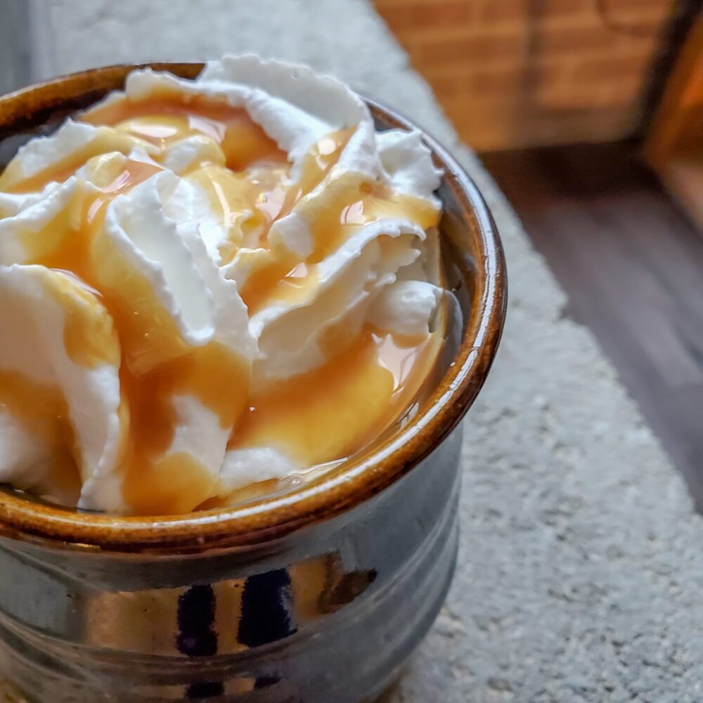 coffee drink with caramel and whipped cream